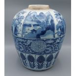 A Chinese blue and white jar of tapering form decorated with landscapes amongst foliage, 27cm tall