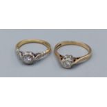 An 18ct gold solitaire diamond ring, 2.9gms, ring size K together with a 9ct gold solitaire