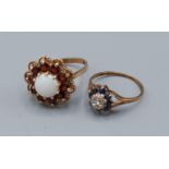 A 9ct gold opal and garnet set cluster ring, 3.8gms, ring size N together with another 9ct gold