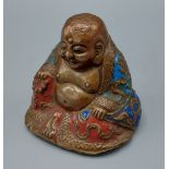 A Chinese patinated bronze and enamel model in the form of Buddha, 8cms tall
