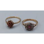 An 18ct gold diamond and ruby cluster ring, 2.6gms, ring size N together with a 9ct gold garnet