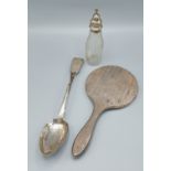 A Victorian silver basting spoon, together with a silver backed hand mirror and a white metal