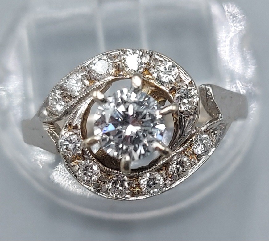 An 18ct white gold diamond cluster ring, the central diamond approx. 0.50ct surrounded by smaller - Image 2 of 2