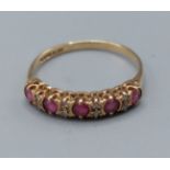 A 9ct gold ring set with five rubies interspersed with diamonds, ring size P, 1.4gms