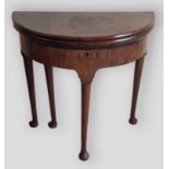 A George III mahogany demi lune tea and card table, the double hinged top above a plain freeze