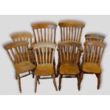 A set of eight elm farmhouse kitchen chairs (six plus two) with lath backs above a shaped seat