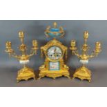 A 19th Century French gilded and porcelain mounted three piece clock garniture, the clock