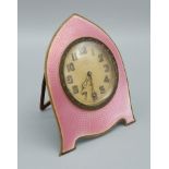 A Birmingham silver and pink enamel decorated table clock the dial inscribed Sir John Bennett Ltd