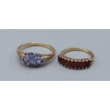 A 9ct gold Amethyst set cluster ring, 2.7gms, ring size T together with a 9ct gold garnet set band