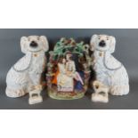 A Staffordshire pottery flatback figure group The Courting Couple, together with a pair of