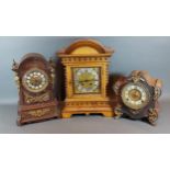 An early 20th Century walnut mantle clock together with two other mantle clocks