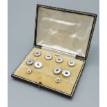 A set of 18ct gold, Platinum, diamond set and Mother Of Pearl dress studs and cufflinks retailed