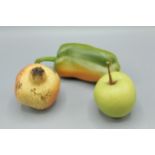 A Penkridge ceramic model of an apple together with a green pepper and a pomegranate