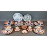 Six Imari decorated dishes, together with two blue and white decorated dishes, a Chinese bowl and