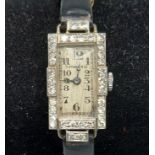 A Diamond encrusted cocktail watch by Tiffany and Co. The rectangular dial with Diamond bezel and