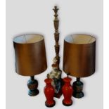 A pair of oriental style metal table lamps, together with a pair of table lamps in the form of vases