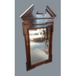 A rectangular Chippendale style wall mirror, the architectural pdiment above a rectangular plate