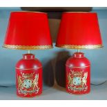 A pair of Toleware table lamps, each with gilded decoration on a red ground, complete with