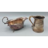 A Birmingham silver sauce jug together with a London silver mug, 9ozs