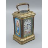 A French brass cased miniature Carriage clock with porcelain panels, lever escapement and carrying