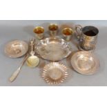 An 800 mark silver bowl, together with three silver dishes, a white metal mug, three small cups, a