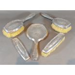 A Chester silver backed four piece dressing table set, together with a matching brush back