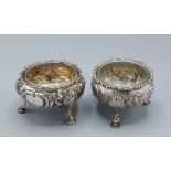 Two Georgian silver salts, each with three shell and hoof feet
