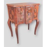 A French style chest, the inlaid shaped top above two marquetry inlaid drawers with brass drop