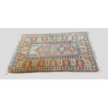A Turkish wooden rug with all over design upon a terracotta ground, 190cm by 125cm