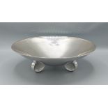 A German 800 mark silver bowl of stylised form with three supports, 23ozs, 31cms diameter