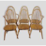 A set of six Ercol blonde ash stick back dining chairs comprising two armchairs and four singles