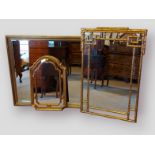 A rectangular gilt framed wall mirror, 101cms x 131cms together with two other wall mirrors