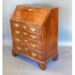 A 19th Century Mahogany Bureau, the fall front enclosing a fitted interior above four long drawers