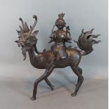 A Chinese patinated bronze Censor in the form of a figure on Qilin, 26cms tall