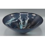 Morag Gordon, a studio glass bowl, decorated with figures upon a blue ground, 32.5cms diameter