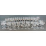 A set of eleven cut glass Champagne glasses together with a collection of similar drinking glasses