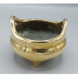 An early Chinese bronze Censor with two handles and seal mark to base, 12cms diameter