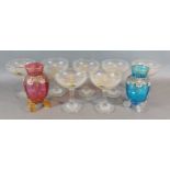 A set of six Babycham pedestal glasses together with two glass vases