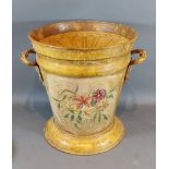 A toleware two handled lidded bucket with foliate decoration, 33cm tall