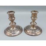A pair of London silver dwarf candlestick, 10cms tall