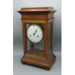 A 19th Century French library clock, the enamel dial inscribed Bourret A Paris, with Arabic numerals