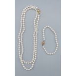 A single string pearl necklace with 9ct gold clasp, 76cms long together with a matching bracelet