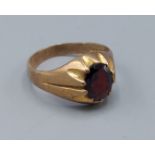 A 9ct gold garnet set gentleman's ring, ring size S, 4.6gms