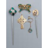 A yellow metal brooch of bow form set with Torquoise and pearl together with a similar earclip,