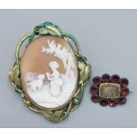 A cameo brooch decorated in relief with a figure and dog together with a Victorian mourning brooch