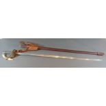 A Victorian officer sword with brass hilt and leather scabbard, length of blade 82cms long