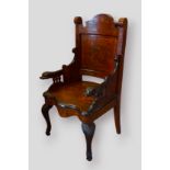 A 19th Century Dutch marquetry large armchair, the shaped back above a serpentine seat, raised