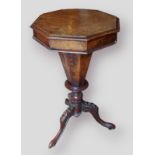 A Victorian burr walnut trumpet shaped work table raised upon three carved legs, 74cms tall