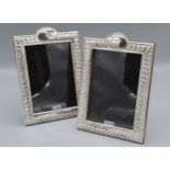 A pair of 925 silver photograph frames of rectangular form with arched cresting, 19.5cms X 14cms