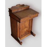 A Victorian walnut Davenport together with three occasional tables, a hanging corner cabinet and a